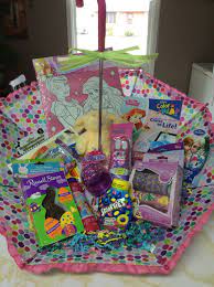 Plush baskets like this my first easter basket make great easter gifts for baby girls, too. Umbrella Filled With Gifts And Easter Treats For A Little Girl Easter Gifts For Kids Homemade Easter Baskets Kids Easter Basket