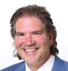 TRAVIS R. HOLLIFIELD