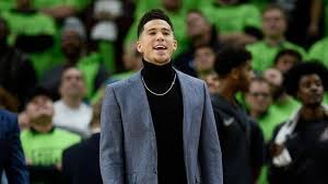 Find the perfect devin booker stock photos and editorial news pictures from getty images. Devin Booker S Courtside Style Draws Attention Of The Rock Biloxi Sun Herald