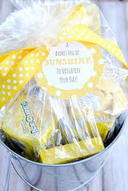 A sunshine box is a fun gift to not only give, but to put together! Colorful Gift Basket Ideas A Girl And A Glue Gun