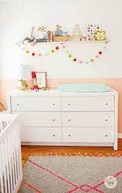 A Nursery Filled With Fun Bright Colors Think Make Share Nursery Shelves Nursery Colors Nursery Paint Colors