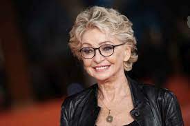 Italian former actress, television and radio presenter, and lyricist. Lhoq Xrrm4r07m