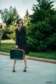 Check spelling or type a new query. Jeune Femme En Vintage Robe A Pois Noir Avec Valise R Stock Photo Crushpixel