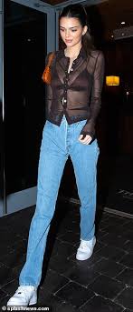 Kendall Jenner flashes her bra beneath sheer blouse (and misses a ...