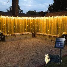 Just drape the lights from hooks screwed into the wood arches or between the posts. Amazon Com Solar Curtain Lights Outdoor 13ft L X 3 3ft H 8 Mode 200 Led Solar String Lights For Pool Glass Fence Handrail Railing Eaves Wall Pavilion Wedding Arch Decoration Waterproof Dark Green Warm White Tools Home Improvement
