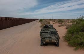 U.S. soldiers guard the border wall in New Mexico