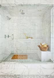 The bottom 1 1/2 rows of tiles on 2 walls are turning gray. Marble Walk In Shower