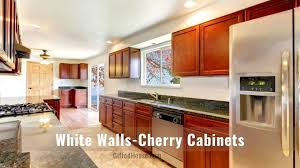 The specific color you select depends upon whether you're trying to create a bold look or one that is a bit more subtle and warm. Cherry Wood Kitchen Cabinets Countertop Wall Colors