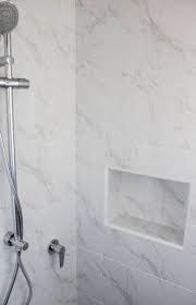 This white and gray bathroom features ikea vanities and herringbone floor. Bathroom Marble Shower Layout 37 Ideas Marble Showers Carrara Bathroom White Marble Shower