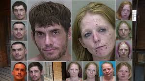 Couple found 'passed out' by a dumpster 'with a bag of syringes,' tin foil  and a white substance, cops say