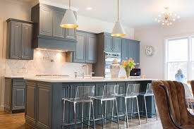 A white backsplash is often used to create a chic and trendy modern farmhouse kitchen, while natural and earthy colors offer a more rustic finish. Gray Blue Kitchen Cabinets Transitional Kitchen