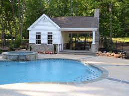 Outdoor kitchen or living room. Pool House Outdoor Kitchen Fireplace Greensward Llc