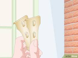 When hanging garland around a doorframe, making it stick to a wooden column, or attaching it to the clapboard siding of a house wall, it is damage when hanging garland around a door is typically caused by hammering in nails or large staples. 3 Simple Ways To Hang Garland On Brick Wikihow