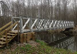In most instances, building a bridge driveway is necessary to span a creek. Trail Bridge Kits Atv Bridges Rollingbarge Com
