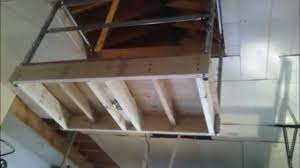 Attach your larger pulleys well to a stable board built inside your attic. Garage Attic Lift Youtube