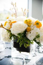 Black And Yellow Flowers I Love This Floral Design Not As Crazy About The Vase Yellow Flower Arrangements Flower Arrangements Center Pieces Spring Flower Arrangements Centerpieces