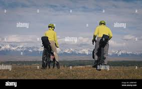 The man and woman travel on mixed terrain cycle touring with bikepacking.  The love couple journey with tent in nature with bicycle bags. Stylish bikep  Stock Photo - Alamy