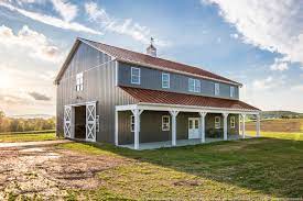 Pole barns are an inexpensive alternative to standard wood trusses and time consuming stick built methods. Two Story Pole Barn With Colonial Red Abseam Roof And Charcaol Abm Panel Sides Farmhouse Exterior Philadelphia By A B Martin Roofing Supply Houzz