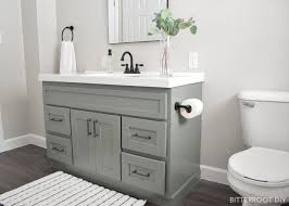 To save even more money, we used a secondhand sink and reclaimed marble tile to cover the vanity top. Diy Bathroom Vanity Makeover