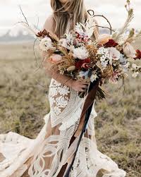 Summer bunch with blue thistle flowers, jana roses, eucaliptus and olive leaves, black berries, white snapdragon flowers. 15 Gorgeous Bridal Bouquets Using Dried Flowers Lyceum Of Galveston