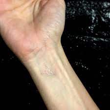 Some come in simplistic colors while others are more elaborate. White Ink Dove Tattoo On The Wrist Tattoo Artist Ok Small Tattoos White Dove Tattoos Dove Tattoos