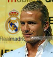 Beckham pulled off this hairdo when he joined real madrid from manchester united for a staggering fee of £35 million back then. British Soccer Star David Beckham Smiles In Front Of The Real Madrid David Beckham Long Hair David Beckham Hairstyle Beckham Hair