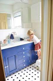 Thinking about painting your bathroom cabinets or vanity? Navy Blue Vanity Makeover At Charlotte S House