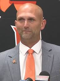 Hoover High School football coach, defensive coordinator placed
