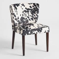 Boasting A Curved Petite Profile Our Side Chairs Make A Modern Statement With Black And White Cow Prin Dining Chairs White Dining Chairs Modern Dining Chairs