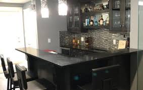 A smartly designed pantry sits at either side of this kitchen featuring shelves, racks and storage for dried goods, condiments and spices. Bars Efficient Kitchen Cabinets