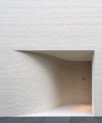 An Exposed Brick Wall In A Room Doesn T Always Mean Industrial Moreover If We Talk About The Specific White Br Brick Architecture Entrance Design Brick Facade