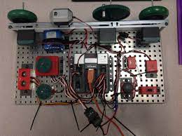 To the right of the cortex, attach the limit switch, bump switch, and line tracker. Vex Test Bed Caleb Herrera