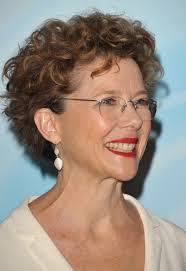 These swirling curls make an amazing hairstyle for professional women over 50. Short Curly Haircut For Women Over 50 Lively Curls In Razored Cut Annette Bening Hairstyle Hairstyles Weekly