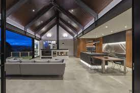 The Concrete Look Epoxy Flooring In This House Neatly Ties Together The Kitchen And Living Areas It Also Elevates The Moder In 2021 Award Winning Kitchen Timber House