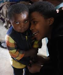 Refugee Mentors Fill Family Roles as Resettlement Opponents Vow to Keep  Fighting