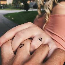 The size of the tattoo can vary but most pe of the time people prefer to go for the small tattoo design. Pinterest Hollyparrker Matching Couple Tattoos Finger Tattoos For Couples Matching Tattoos