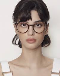 Add a pop of color to your look with the Bob frame from Manomos. Available  in clear, pink, and brown, these round acetate frames offer a playful yet  stylish edge. A perfect
