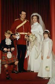 Anne was dressed in a simple white suit with white blossoms in her hair and timothy was wearing his royal navy uniform. Royal Wedding Gowns Iconic Royal Brides