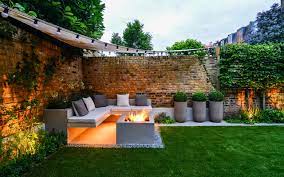 The covered patio also hosts a cozy seating area furnished with croft house chairs. 18 Cosy Outdoor Seating Areas For Cool Evenings Houzz Uk