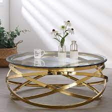 The open design creates a welcoming feeling and provides ample space to put drinks or decor on top. Enrico Clear Glass Coffee Table With Gold Stainless Steel Legs 529 95 Go Furniture Co Uk