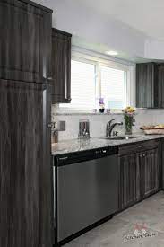 This Kitchen Features Cabinets In Our Exquisite Merapi Color With Stylishly Distressed Finish Kitchen Cabinets Laminate Kitchen Cabinets Grey Kitchen Cabinets