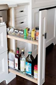 A Pull Out Spice Rack Is Camouflaged Between White Shaker Cabinets With Black Pulls Spice Rack Next To Stove Kitchen Spice Racks Drawer Spice Rack