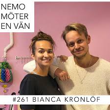 She wears her hair in a high braid with shades of blue. 261 Bianca Kronlof Teaser Nemo Moter En Van Podcast Podtail