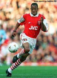 Ian wright urges arsenal to continue their pursuit of lyon's houssem aouar to offer a new creative dimension in midfield next to thomas partey before claiming mikel arteta has 'changed the mentality and culture' of the club. Ian Wright Soccer