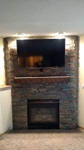 How a gas log lighter is installed in your wood burning fireplace. Great American Fireplace Installed This Corner Fireplace Stone And Custom Rustic Mantel Corner Gas Fireplace Gas Fireplace Makeover Corner Stone Fireplace