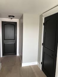 Black Doors White Trim Hallwayideas In 2020 White Walls White Hallway Black Interior Doors