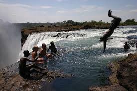 Not Really A Beach But How Amazing And Scary Is This Devils Pool At Victoria Falls Natural Swimming Pools Amazing Travel Destinations Victoria Falls Zambia
