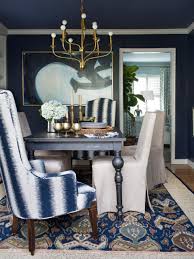 The color on the walls. Dining Room With Blue And White Chair Plus Brass Chandelier Hgtv