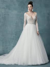 To create such a dramatic look, many ball gown wedding dresses use layers of tulle or crinolines, a type of stiff underskirt. Long Sleeve Lace Tulle Ball Gown Wedding Dress Kleinfeld Bridal