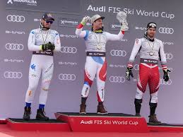 L'azzurro ai piedi del podio. Beat Feuz Sui And Nicole Schmidhofer Aut Fis Ski World Cup Downhill Champions 2019 All Pyrenees France Spain Andorra